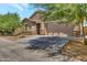 Inviting single-story home boasting a two-car garage, desert landscaping, and mature shade trees at 9630 W Atlantis Way, Tolleson, AZ 85353