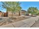 Cozy single-level home enhanced with desert landscaping and a quaint, low-maintenance front yard at 9630 W Atlantis Way, Tolleson, AZ 85353