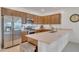 Bright kitchen equipped with stainless steel appliances, a spacious island, and stylish finishes at 9630 W Atlantis Way, Tolleson, AZ 85353