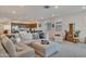 Spacious living room with open floor plan to the kitchen, comfortable seating, and lots of light at 9630 W Atlantis Way, Tolleson, AZ 85353