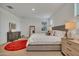 Comfortable main bedroom with large windows, side tables, and stylish furnishings at 9630 W Atlantis Way, Tolleson, AZ 85353
