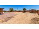 Expansive backyard featuring a gravel area, shed, and potential for landscaping customization at 975 E Lincolnwood Cir, Casa Grande, AZ 85194