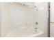 A well-maintained bathtub with tile surround and a shower head at 975 E Lincolnwood Cir, Casa Grande, AZ 85194