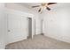 Neutral bedroom with carpeted floors and a closet offering ample storage space at 975 E Lincolnwood Cir, Casa Grande, AZ 85194