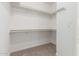 Walk-in closet with carpet flooring and metal shelving at 975 E Lincolnwood Cir, Casa Grande, AZ 85194