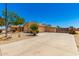 Single-story home boasting a large driveway and desert-style landscaping at 975 E Lincolnwood Cir, Casa Grande, AZ 85194