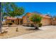 Single-story home with desert-style landscaping and attached two-car garage at 975 E Lincolnwood Cir, Casa Grande, AZ 85194