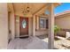 Inviting front porch featuring a decorative door, lantern, and well-kept entryway at 975 E Lincolnwood Cir, Casa Grande, AZ 85194