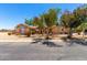Charming single-story home featuring desert landscaping and mature trees for added curb appeal at 975 E Lincolnwood Cir, Casa Grande, AZ 85194