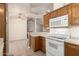 Another view of the kitchen showcasing the stove, microwave and plentiful storage at 975 E Lincolnwood Cir, Casa Grande, AZ 85194