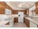 Bright kitchen with tile floor and white appliances at 975 E Lincolnwood Cir, Casa Grande, AZ 85194