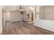Bright living room with wood floors, ceiling fan, and a breakfast bar at 975 E Lincolnwood Cir, Casa Grande, AZ 85194
