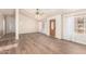 Bright living room featuring modern wood flooring, neutral walls, and ample natural light at 975 E Lincolnwood Cir, Casa Grande, AZ 85194