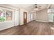 Bright living room featuring modern wood flooring, neutral walls, and ample natural light at 975 E Lincolnwood Cir, Casa Grande, AZ 85194