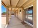Inviting covered patio with a view of the pool and spacious backyard at 975 E Lincolnwood Cir, Casa Grande, AZ 85194