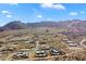 Wide aerial view of a new residential development with homes and mountains in a desert environment at 0 N 128Th St, Scottsdale, AZ 85255