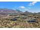 Aerial view of a luxury community with homes nestled in the desert landscape, showcasing mountain views at 0 N 128Th St, Scottsdale, AZ 85255