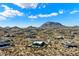 Expansive aerial view showcasing desert homes nestled beneath a clear blue sky and picturesque mountain backdrop at 0 N 128Th St, Scottsdale, AZ 85255
