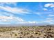 Picturesque view of the desert landscape, revealing sparse vegetation reaching toward mountains on the horizon at 0 N 128Th St, Scottsdale, AZ 85255
