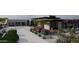 Wide driveway leading to a modern home and a garage with glass doors surrounded by lush landscaping at 0 N 128Th St, Scottsdale, AZ 85255