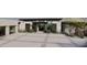 Striking modern entrance with a patterned concrete drive, 4-car garage and manicured landscaping at 0 N 128Th St, Scottsdale, AZ 85255
