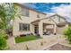 Home's backyard features a covered patio and well maintained desert landscaping at 10050 E Texas Ave, Mesa, AZ 85212