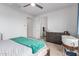 Cozy bedroom features a ceiling fan, neutral carpet and a large dresser at 10050 E Texas Ave, Mesa, AZ 85212