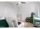 Cozy bedroom features a comfortable chair, closet, and playful decor at 10050 E Texas Ave, Mesa, AZ 85212