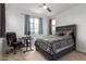 Bedroom with neutral carpet, ceiling fan, large window and queen bed at 10050 E Texas Ave, Mesa, AZ 85212