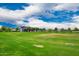 Large, open green space for recreation and relaxation within the community at 10050 E Texas Ave, Mesa, AZ 85212