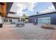Relax in the outdoor seating area with multiple tables and chairs and unobstructed sunlight at 10050 E Texas Ave, Mesa, AZ 85212