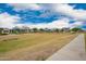 Community park with playground structures, green spaces, and walking paths for residents at 10050 E Texas Ave, Mesa, AZ 85212