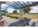 Community park featuring an outdoor seating area surrounded by lush landscaping and a walking path at 10050 E Texas Ave, Mesa, AZ 85212