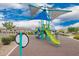 Community playground area with colorful play structures, shaded areas, and soft rubber flooring at 10050 E Texas Ave, Mesa, AZ 85212