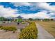 Community playground featuring play equipment and colorful landscaping, with walking path for easy access at 10050 E Texas Ave, Mesa, AZ 85212