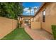 Backyard showcasing a pergola-covered outdoor dining area and a well-manicured path at 1022 W Calypso Ct, Gilbert, AZ 85233