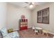 This cozy room offers a charming chair, table with chairs, and a window at 1022 W Calypso Ct, Gilbert, AZ 85233