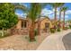 A charming front exterior featuring desert landscaping, stucco and stone accent walls at 1022 W Calypso Ct, Gilbert, AZ 85233