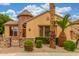 Charming home featuring a turret entrance, a stone accent wall, and desert landscaping at 1022 W Calypso Ct, Gilbert, AZ 85233