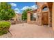 Charming front porch with stone accents and brick-paved patio at 1022 W Calypso Ct, Gilbert, AZ 85233