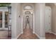 Long hallway with arched ceilings and doorways at 1022 W Calypso Ct, Gilbert, AZ 85233