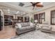 Open-concept living room with ceiling fan, and views to the kitchen at 1022 W Calypso Ct, Gilbert, AZ 85233