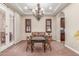 Cozy living area featuring a decorative chandelier, sofa, and stylish decor at 1022 W Calypso Ct, Gilbert, AZ 85233