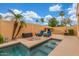 Outdoor pool and patio area with water feature, lounge seating and desert landscape at 1022 W Calypso Ct, Gilbert, AZ 85233