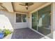 Covered outdoor patio with ceiling fan and decorative pavers at 10609 E Durant Dr, Mesa, AZ 85212