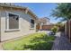 A well-maintained backyard with artificial grass, a decorative fence, and a patio area at 10609 E Durant Dr, Mesa, AZ 85212