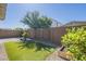 Landscaped backyard featuring artificial turf and a charming decorative block wall at 10609 E Durant Dr, Mesa, AZ 85212
