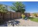 Beautifully landscaped backyard with artificial turf, a decorative wall, and attractive plants at 10609 E Durant Dr, Mesa, AZ 85212