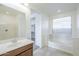 Inviting bathroom featuring a soaking tub and spacious vanity at 10609 E Durant Dr, Mesa, AZ 85212