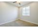 A bedroom features a ceiling fan and a window at 10609 E Durant Dr, Mesa, AZ 85212
